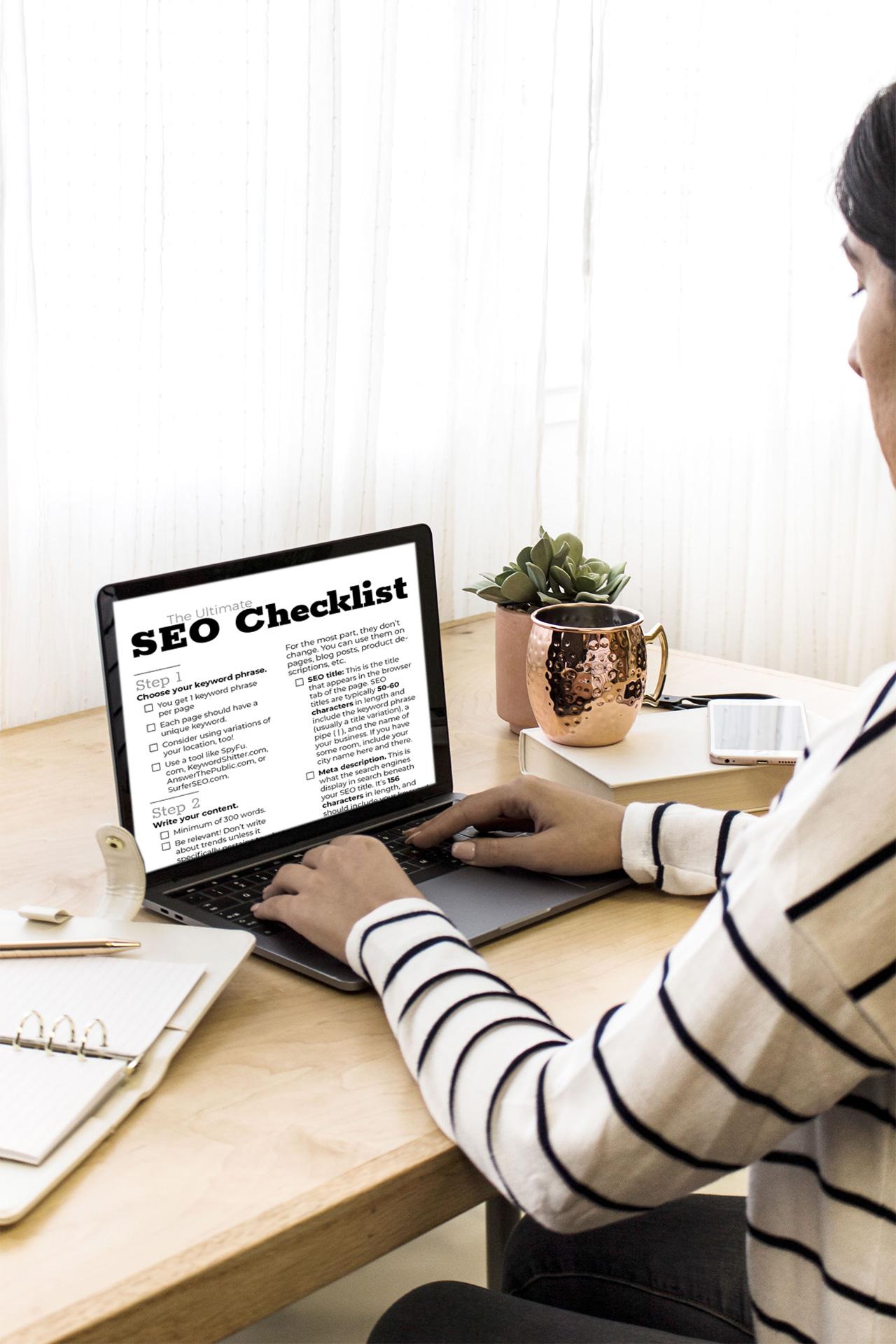 woman going through an seo checklist from a cup of content